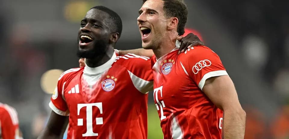 Two Bayern Munich players celebrating together after match