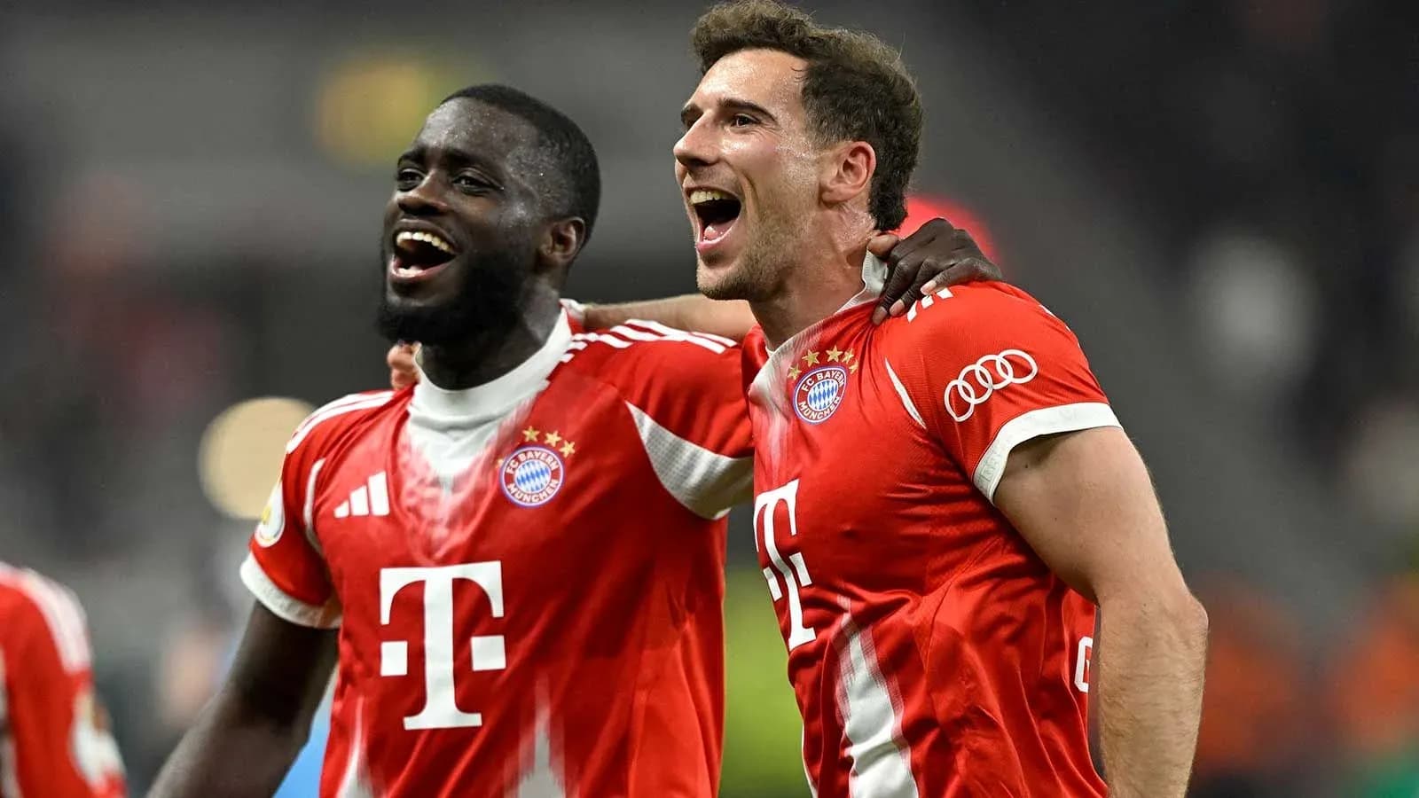 Two Bayern Munich players celebrating together after match