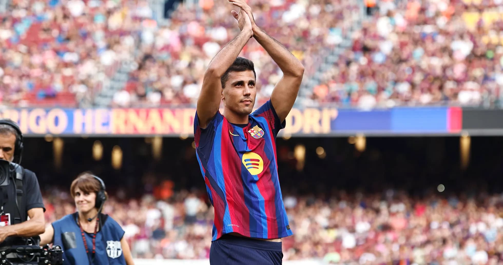 Player applauding fans at stadium during match