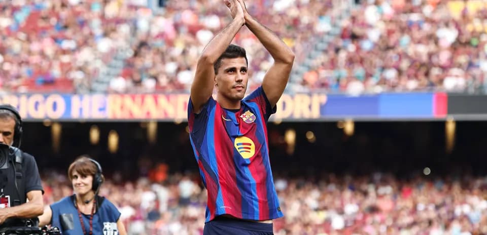 Player applauding fans at stadium during match
