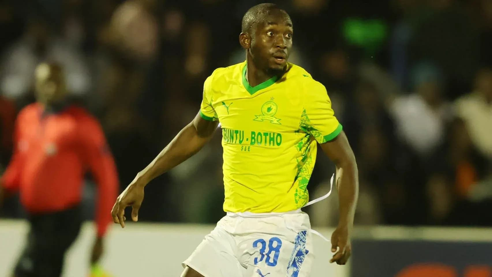 Player in yellow jersey during a football match