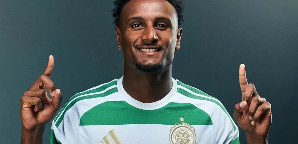 Player posing in Celtic FC jersey with raised fingers