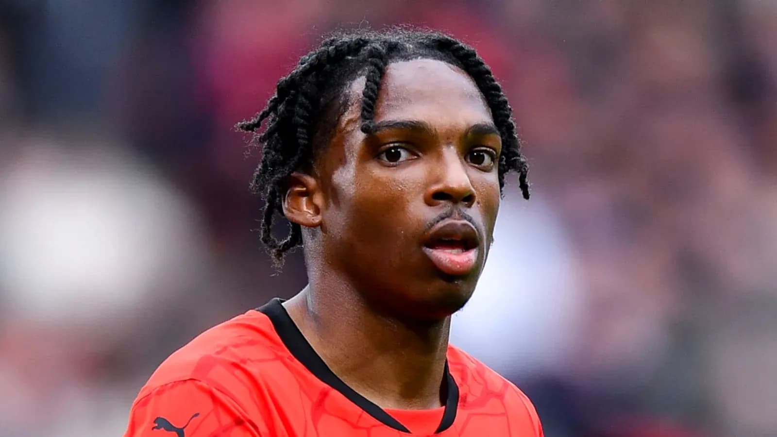 Player in red jersey during match action