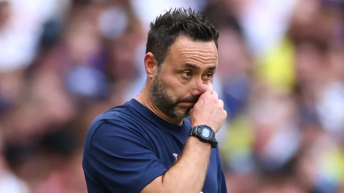 Coach touching his face during match