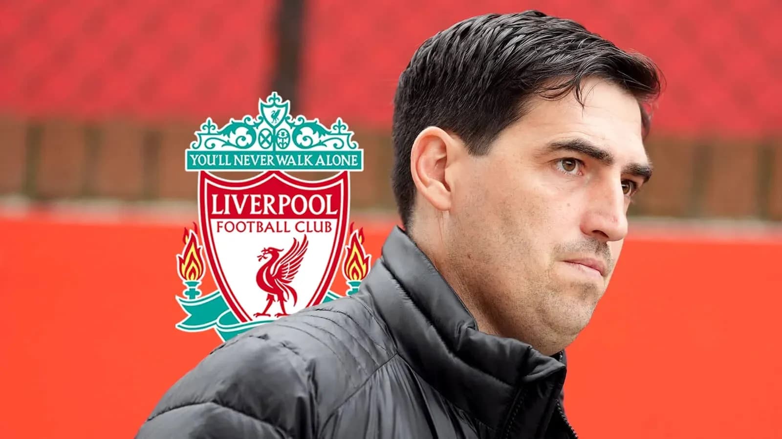 Man in black jacket near Liverpool FC logo