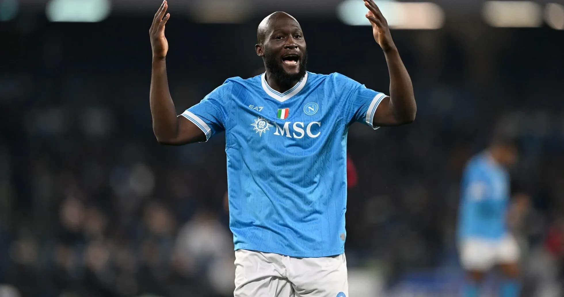 Player celebrating in Napoli jersey during match