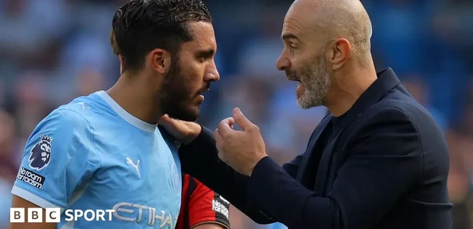 Manager instructing player during match discussion