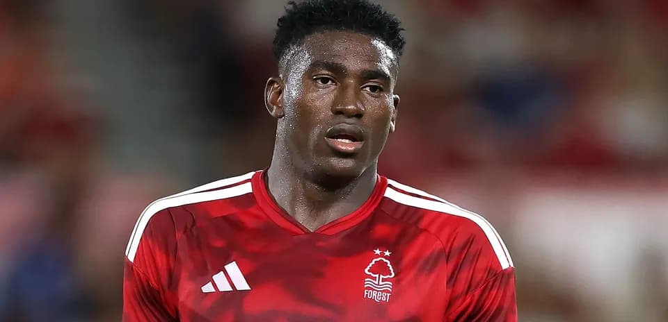 Player wearing red Nottingham Forest jersey on field