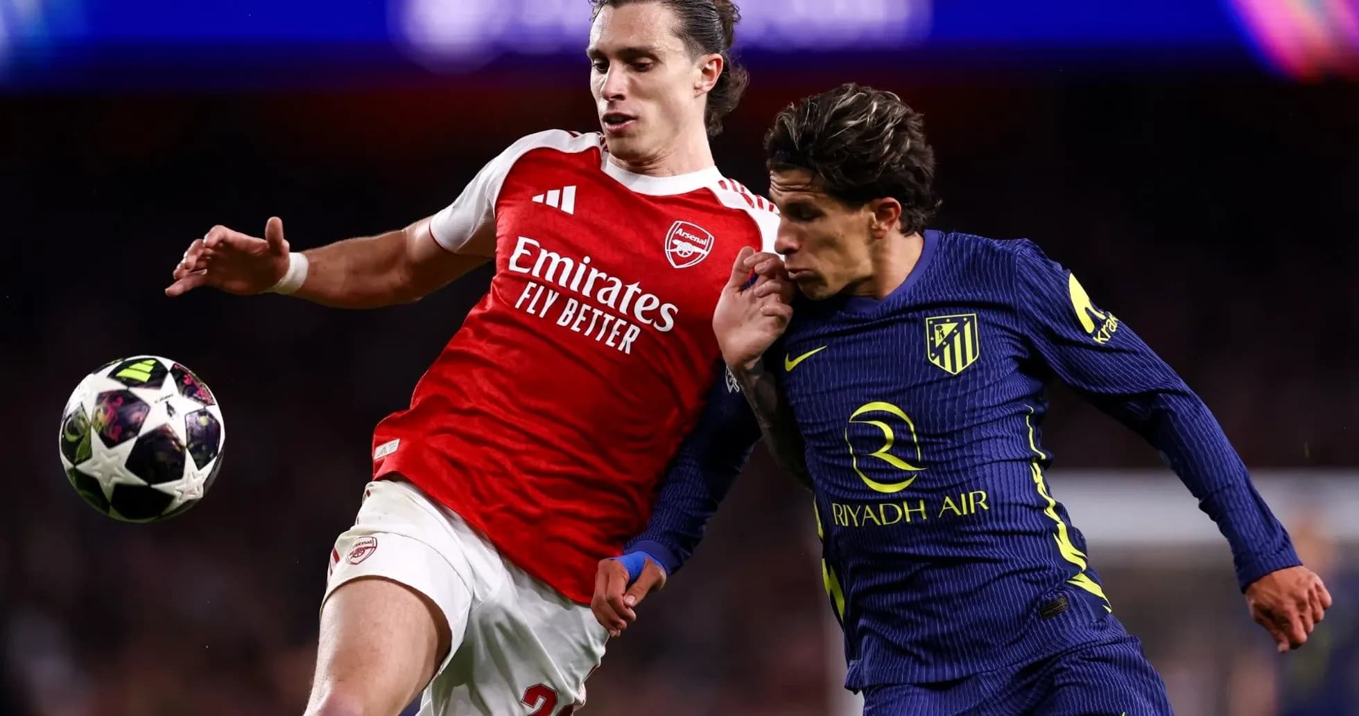 Arsenal and Atletico players battling for the ball