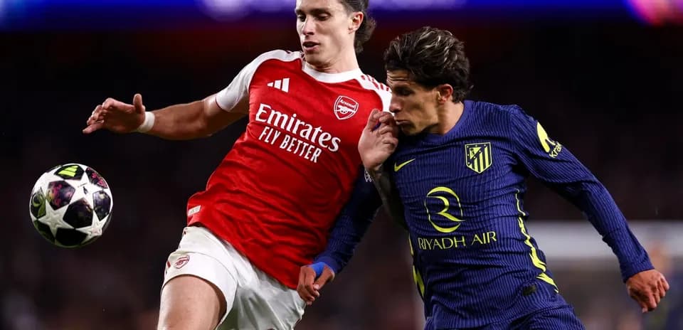 Arsenal and Atletico players battling for the ball