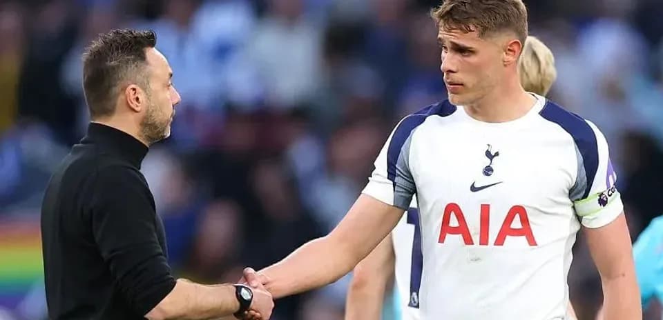Manager and player shaking hands after match