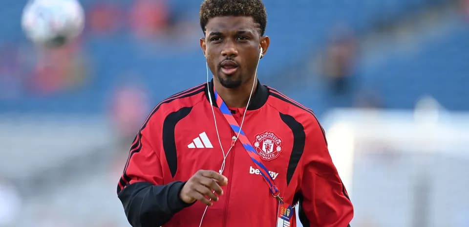 Player in Manchester United training gear walking