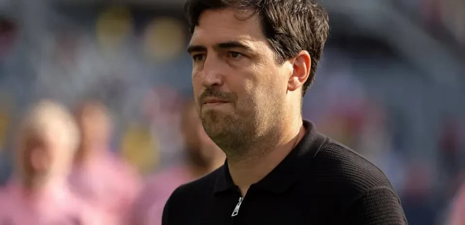 Coach observing players during a match