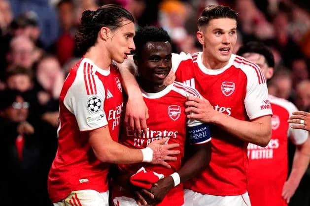 Arsenal players celebrating a goal together