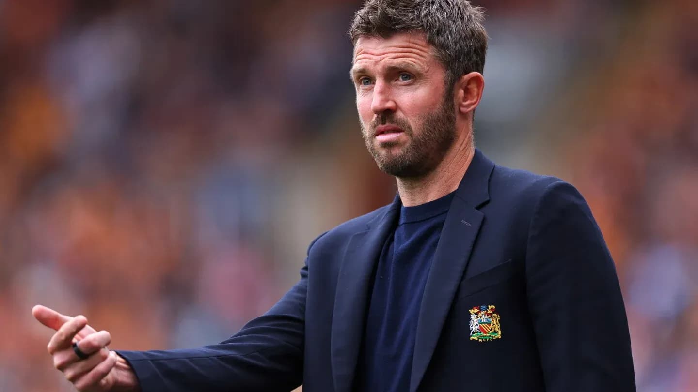 Manager gesturing during a football match