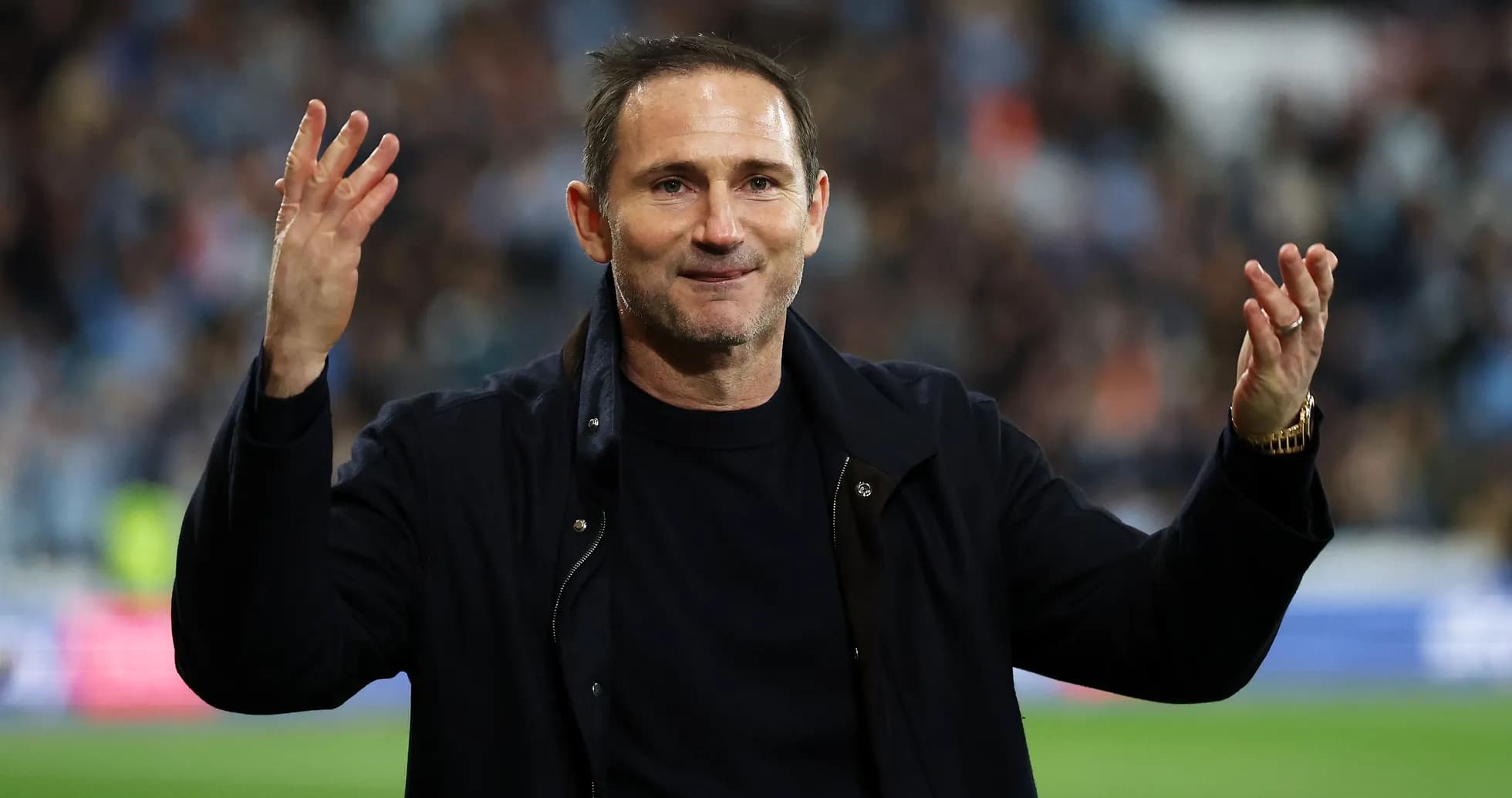 Coach gesturing during a match celebration