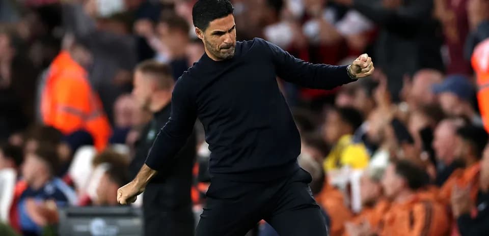 Coach celebrating enthusiastically during a match