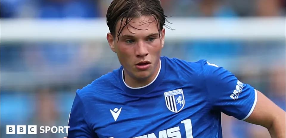 Player in blue jersey running on the pitch