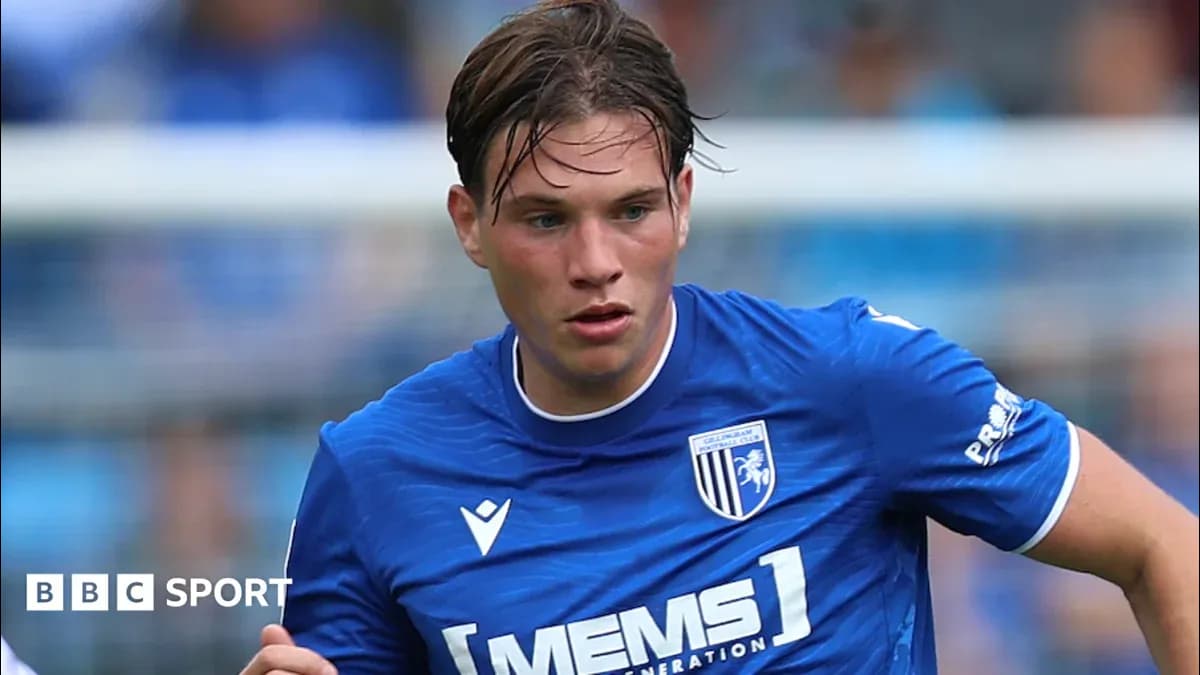 Player in blue jersey running on the pitch