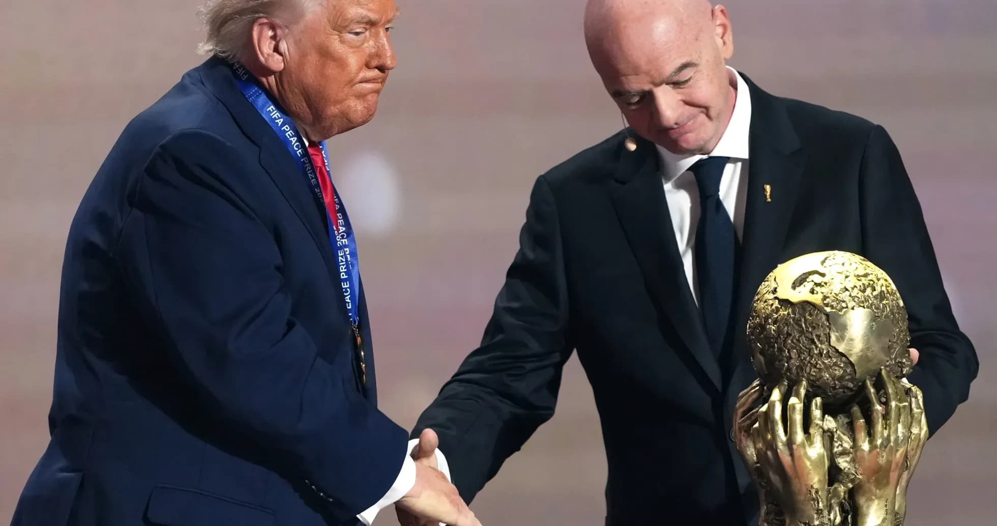 Donald Trump receiving FIFA Peace Prize trophy