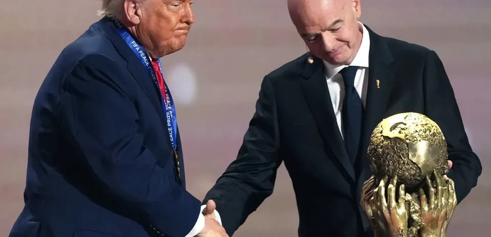 Donald Trump receiving FIFA Peace Prize trophy