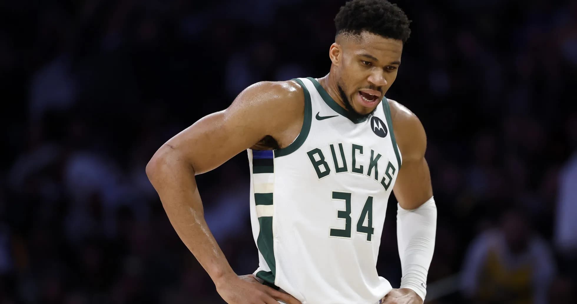 Player in Bucks jersey during a game moment