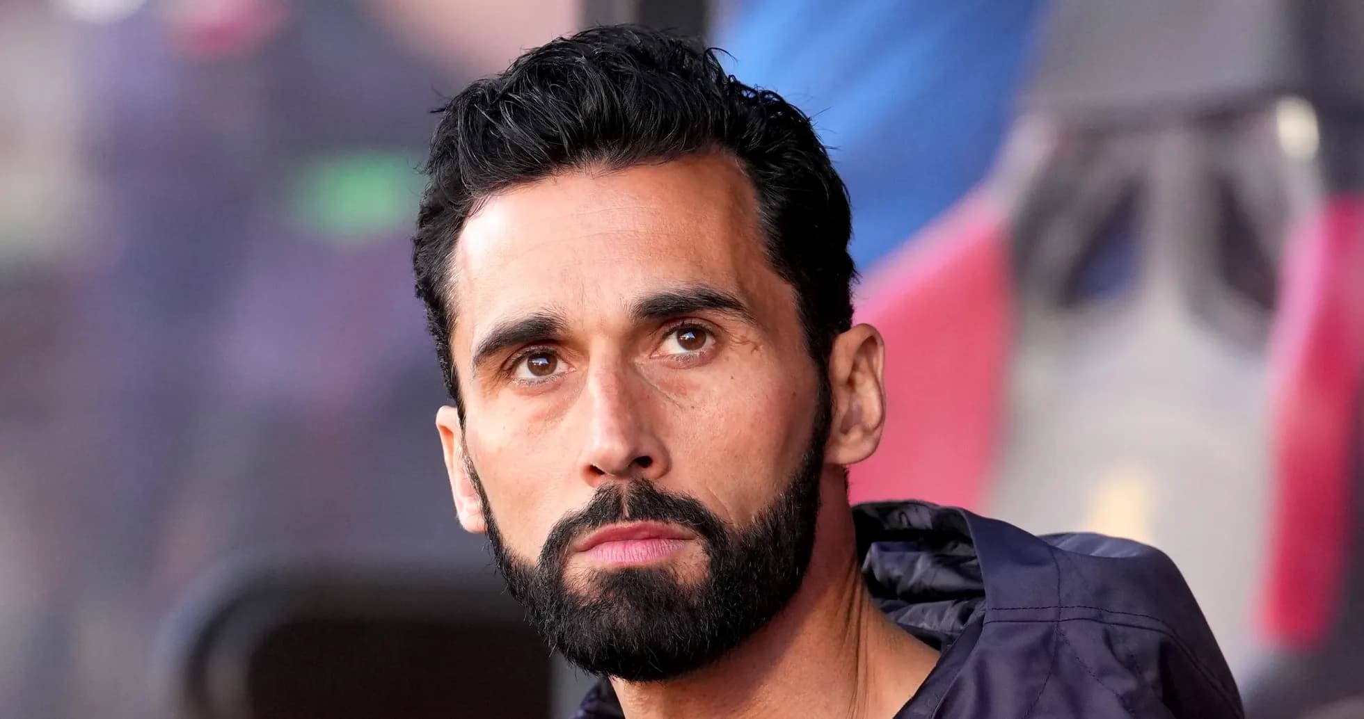 Close-up of a man with a beard looking thoughtfully