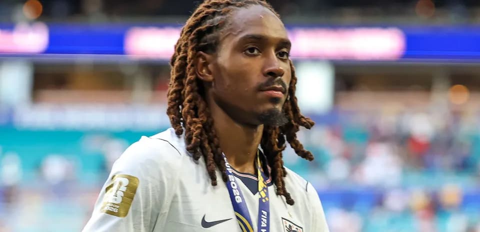 Player wearing England jersey with medal around neck