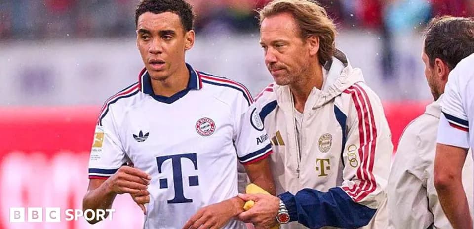 Player being assisted by staff during match