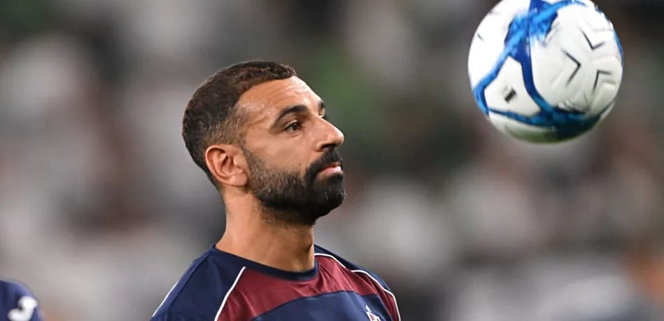 Player juggling a soccer ball during warm-up