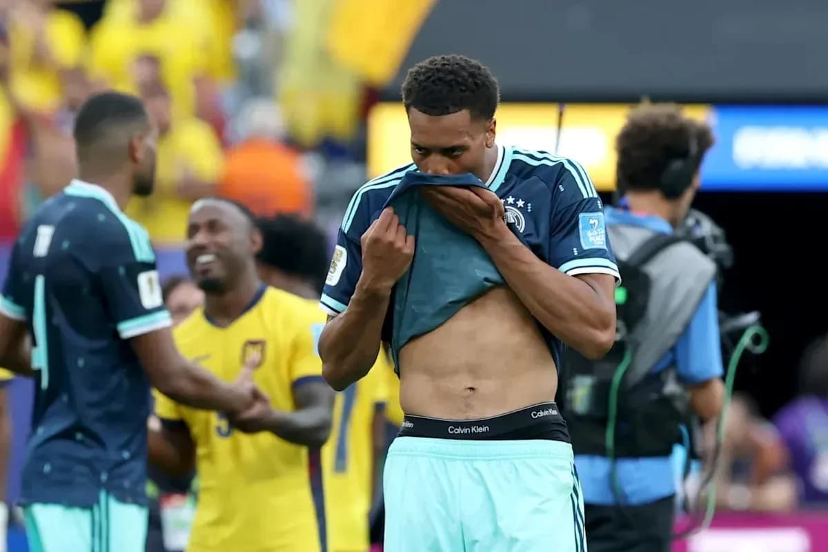 Player removing jersey after match on field