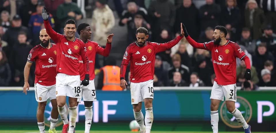 Manchester United players celebrating during a match