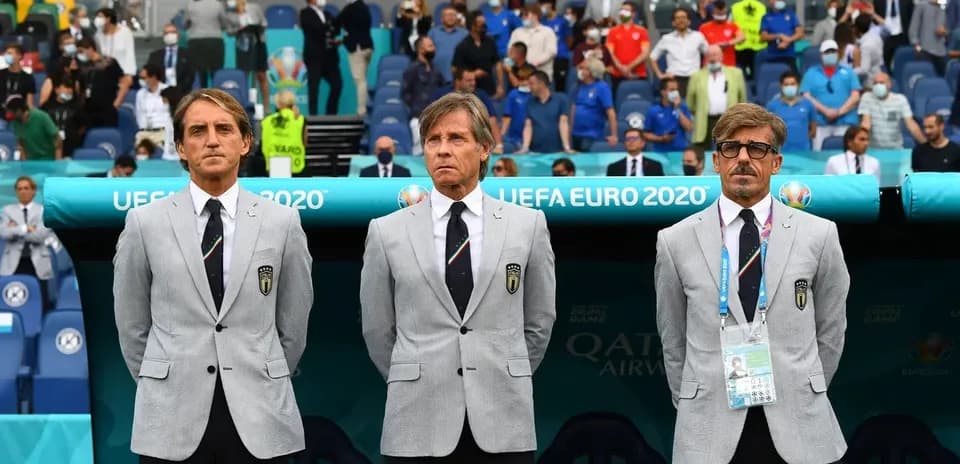 Coaching staff standing on sidelines during UEFA Euro 2020