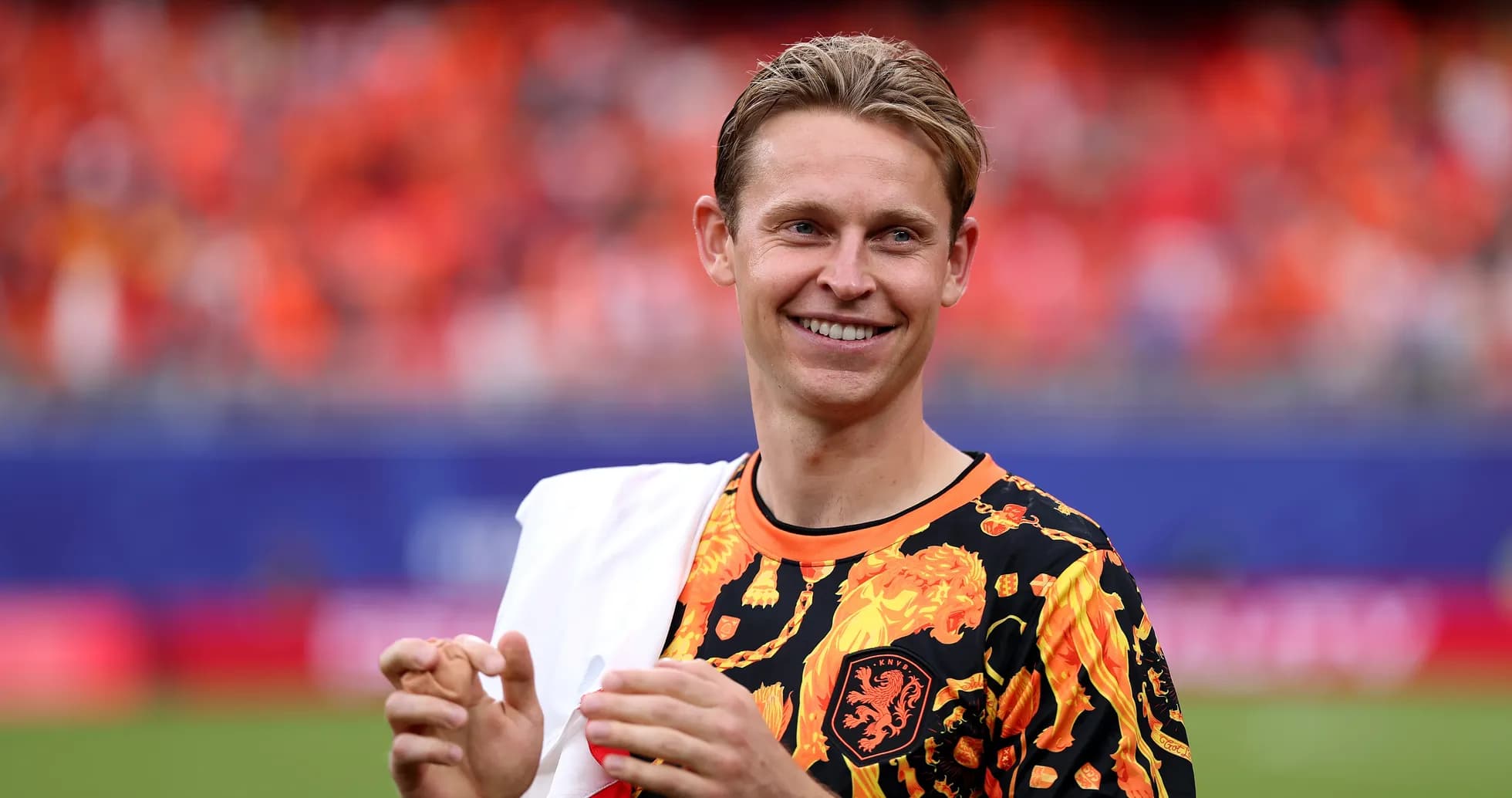 Player smiling while wearing a colorful jersey