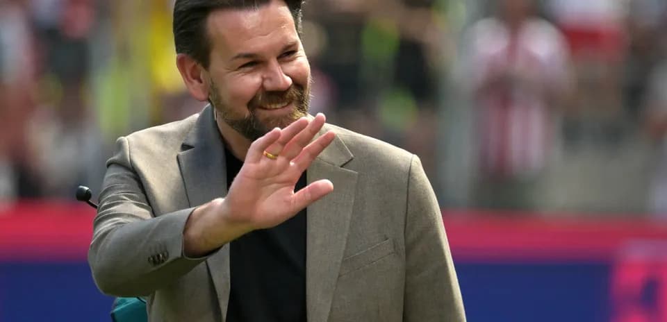 Person waving during a public event