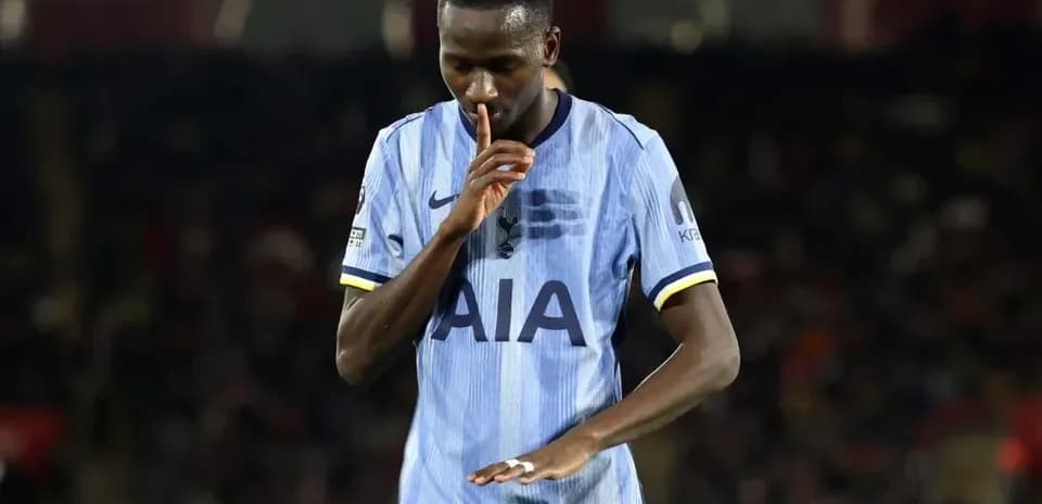 Player shushing fans during a match celebration
