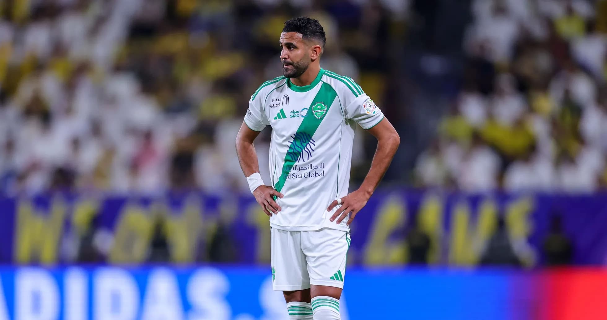 Player in green and white kit on the field