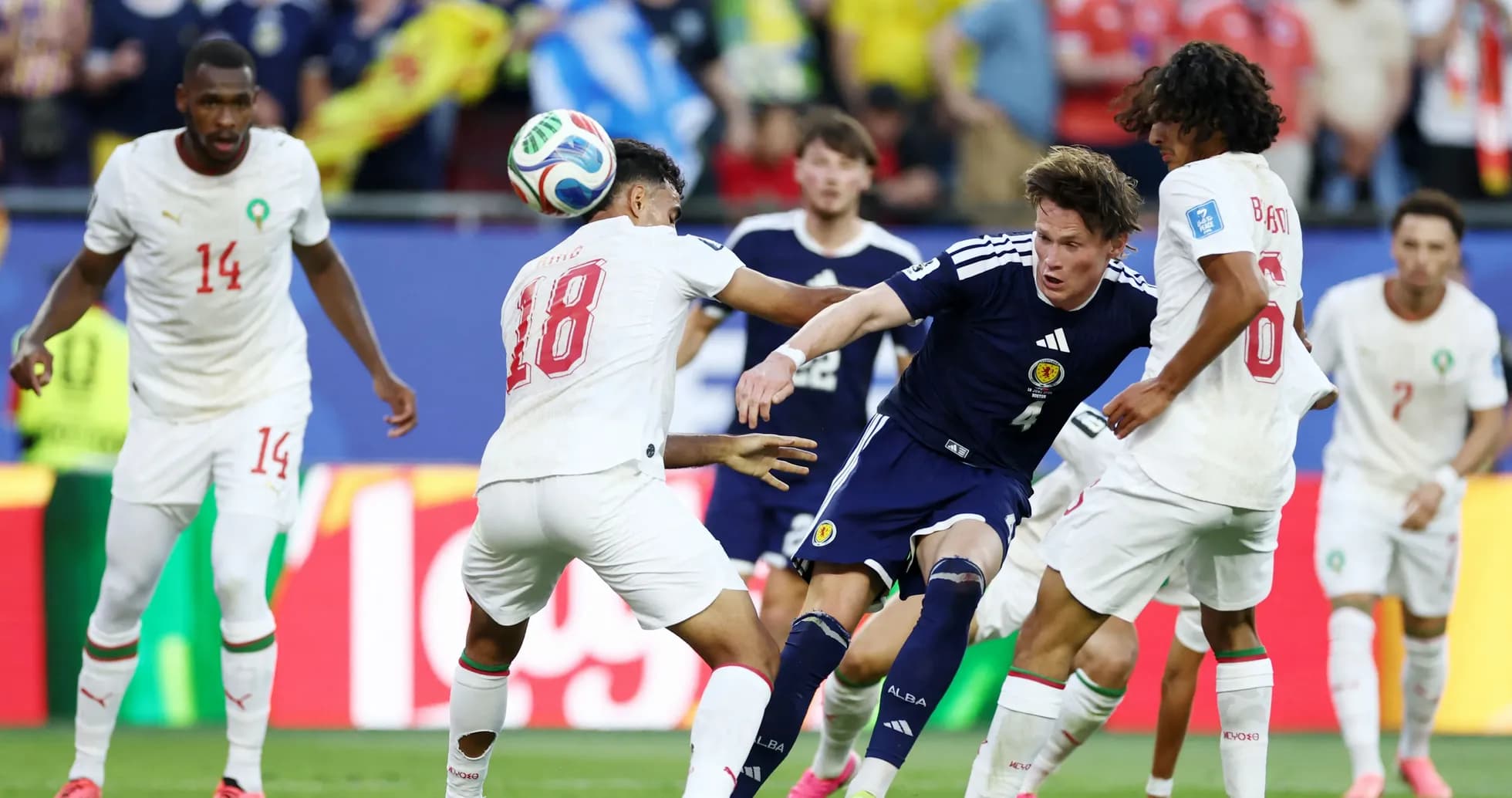Players contesting the ball during a football match