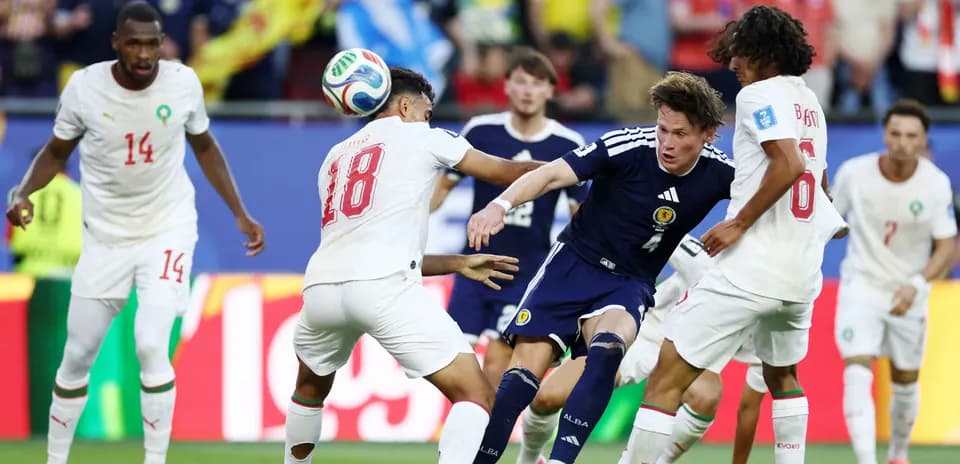 Players contesting the ball during a football match