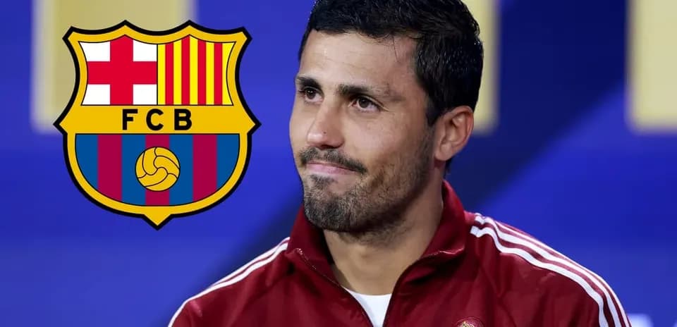 Man speaking at press conference with FC Barcelona logo