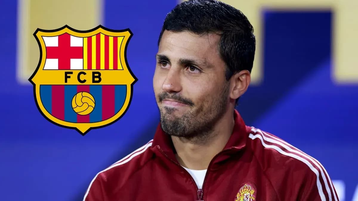 Man speaking at press conference with FC Barcelona logo