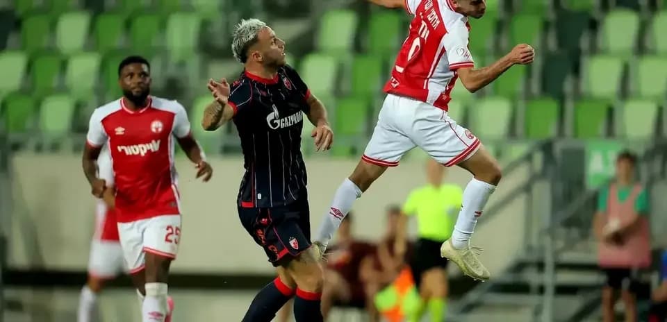 FK Crvena Zvezda player in action against opponent