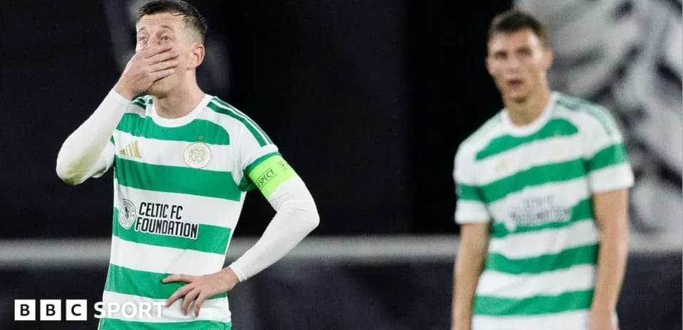 Celtic players reacting during match, one covering face