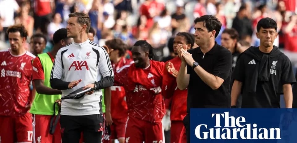 Liverpool players and staff acknowledging fans after match