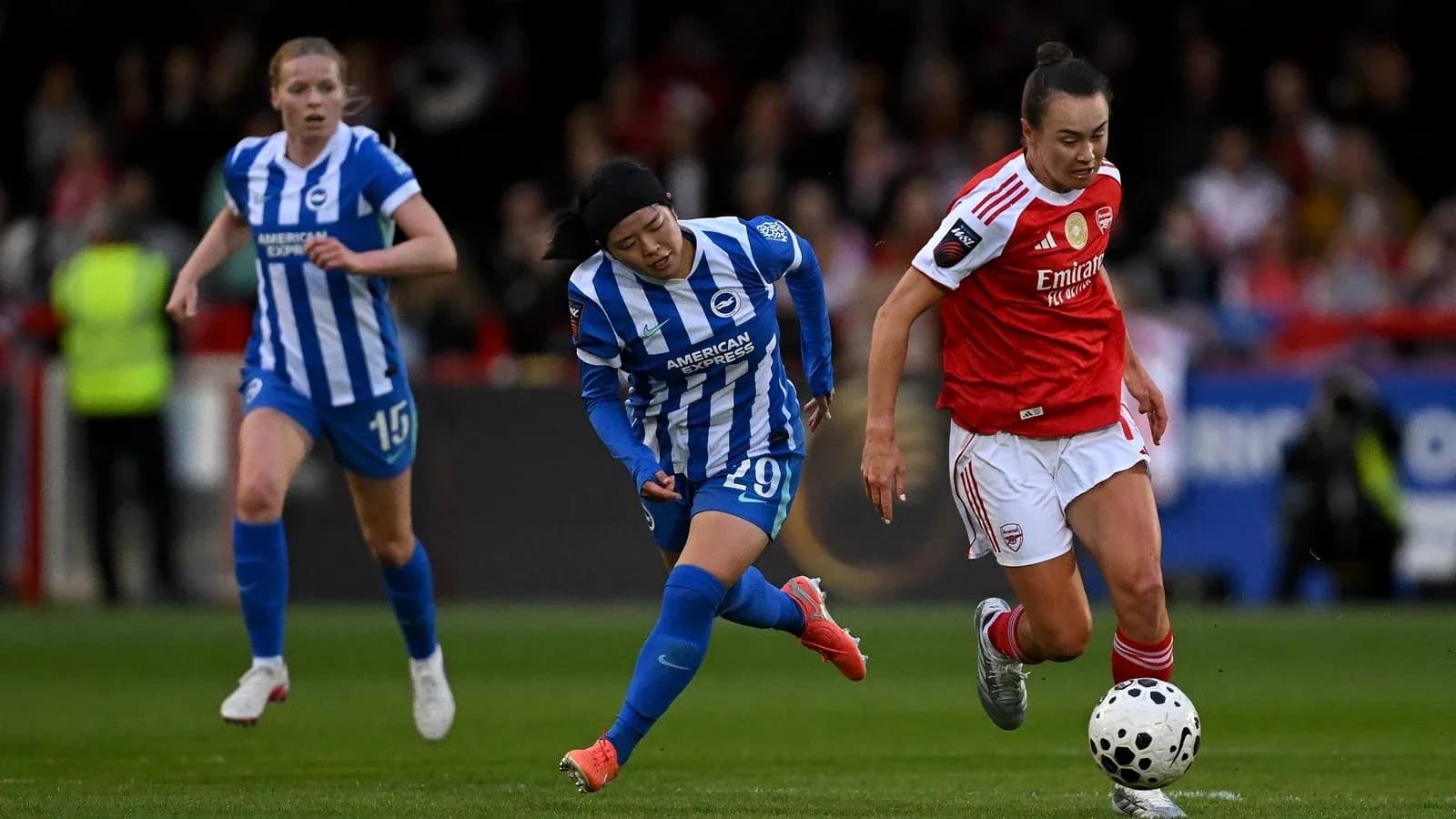 Players competing for the ball during match action