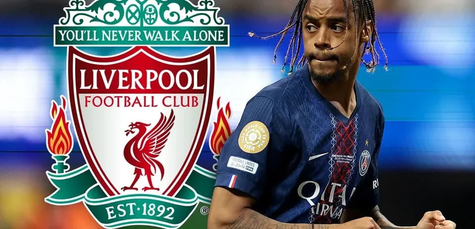 Player in PSG jersey running near Liverpool logo