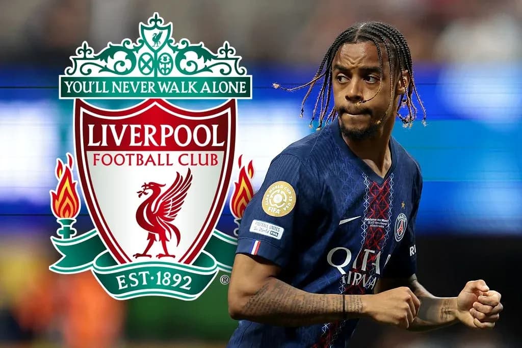Player in PSG jersey running near Liverpool logo