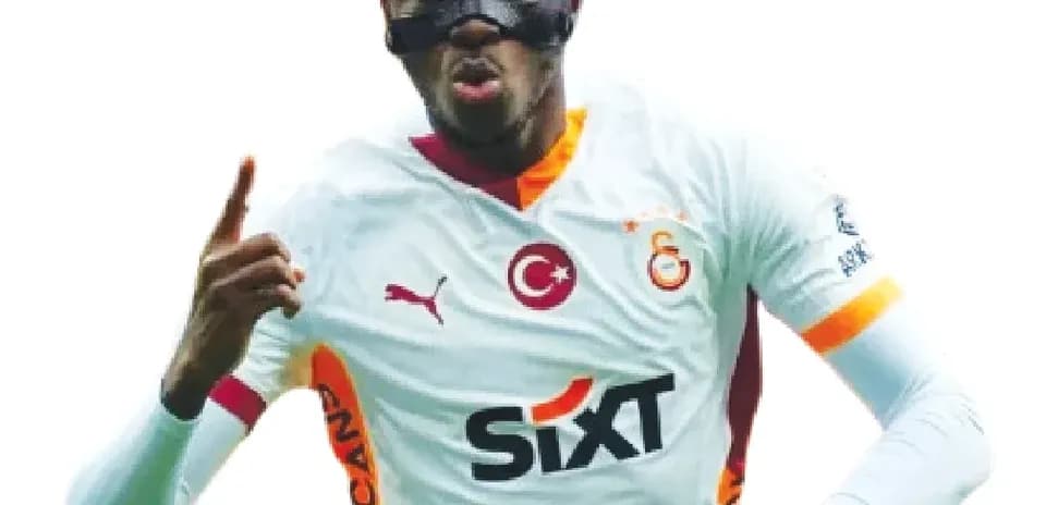 Player celebrating in Galatasaray jersey and mask