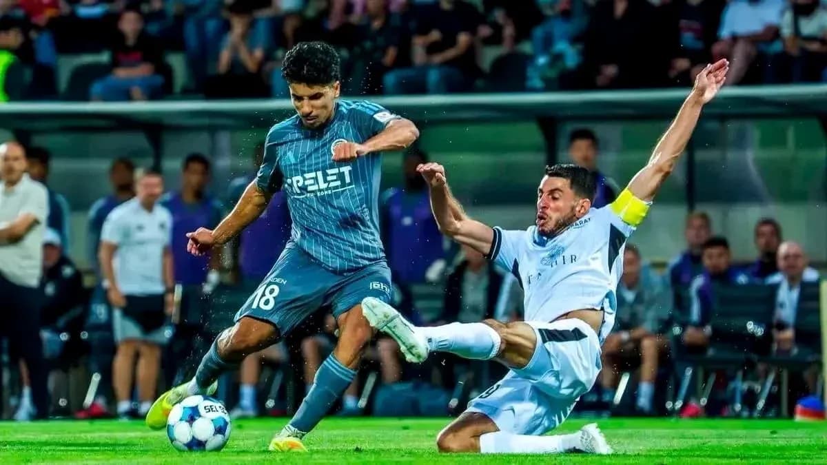 Player tackling during Slovan Bratislava match