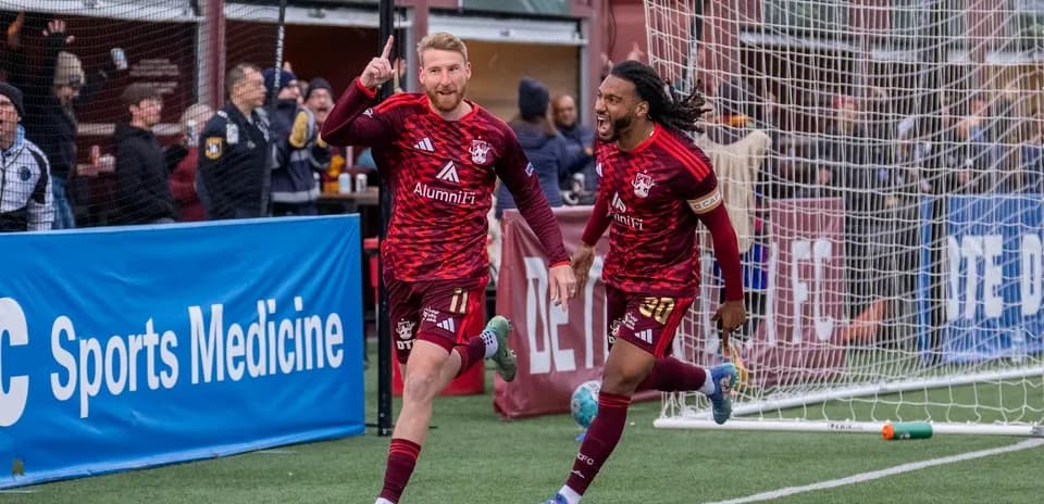 Detroit City players celebrating a goal